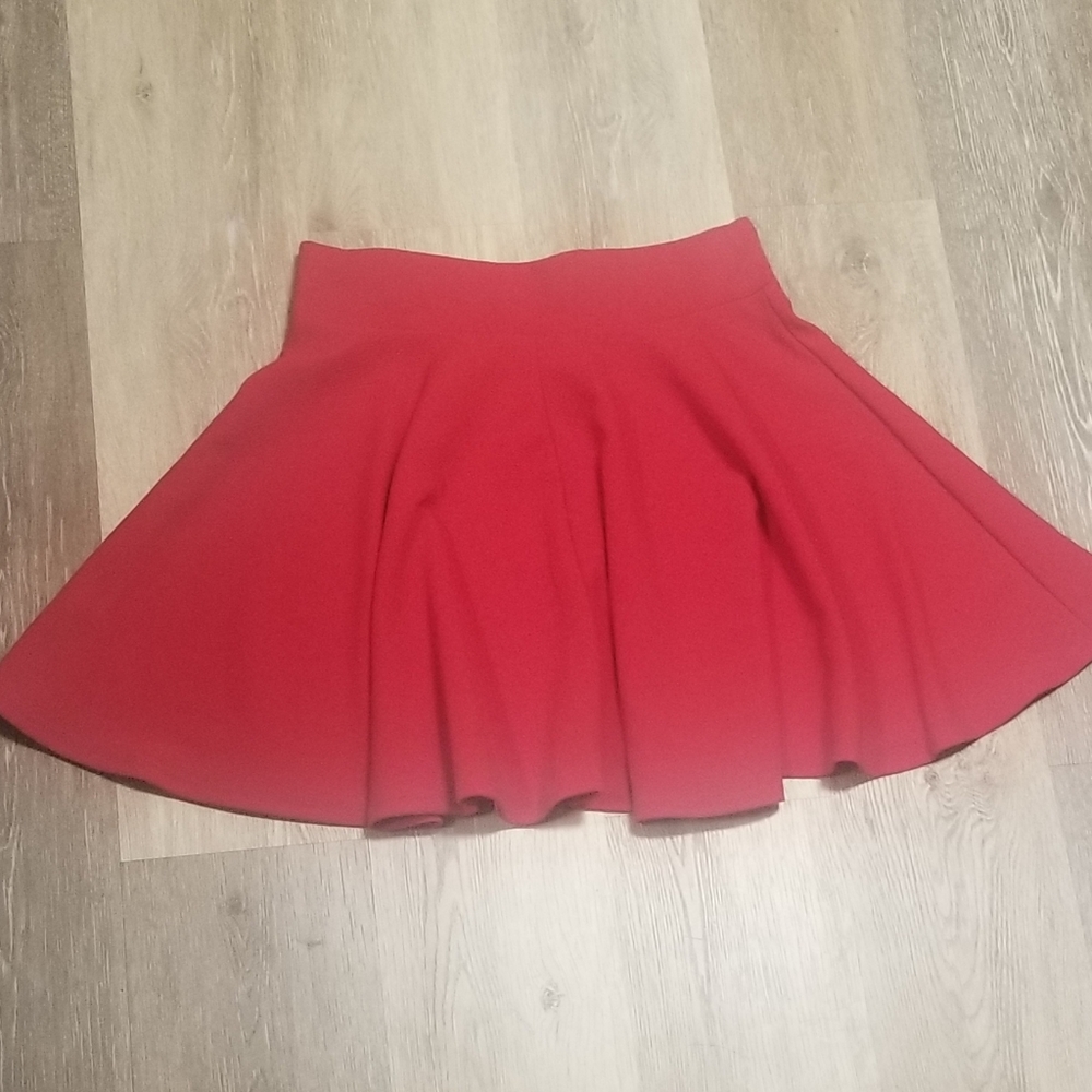 Red skirt with soft pleats and wide waistband